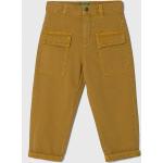 Dětské kalhoty Chlapecké v žluté barvě z bavlny ve velikosti 6 let od značky United Colors of Benetton z obchodu Answear.cz 
