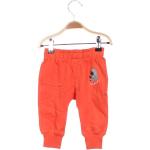 Dětské sportovní kalhoty v oranžové barvě ve velikosti 68 ve slevě 