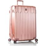 Plastové kufry Heys v pudrové barvě v elegantním stylu z látky na čtyřech kolečkách 