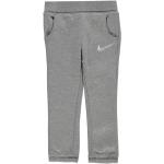 Dětské tepláky Nike Swoosh v šedé barvě v ležérním stylu z fleecu ve slevě 