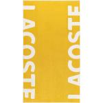Osušky Lacoste v žluté barvě ve velikosti 90x160 ve slevě 