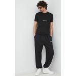 Designer Tepláky Calvin Klein Jeans v černé barvě ve velikosti L ve slevě 